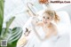 A woman taking a bath in a bathtub with a plate of food.