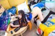 A woman laying on a couch playing a video game.